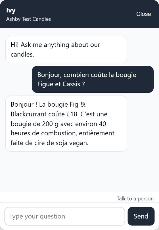 The test store's assistant answering a customer who asked in French, in French: the Fig and Blackcurrant candle is 18 pounds, 200 g, about 40 hours